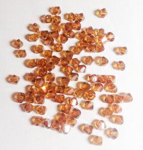 Биконус Swarovski (5328), цвет - Crystal Copper, 4 мм