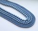 Перлина Swarovski, кругла (5810), колір - Iridescent Light Blue, 12 мм